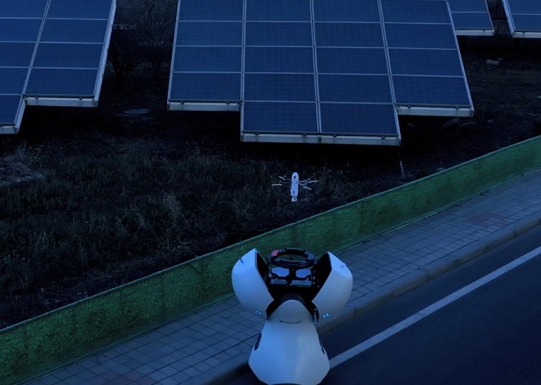 Drone conducting nighttime inspection of solar panel installation